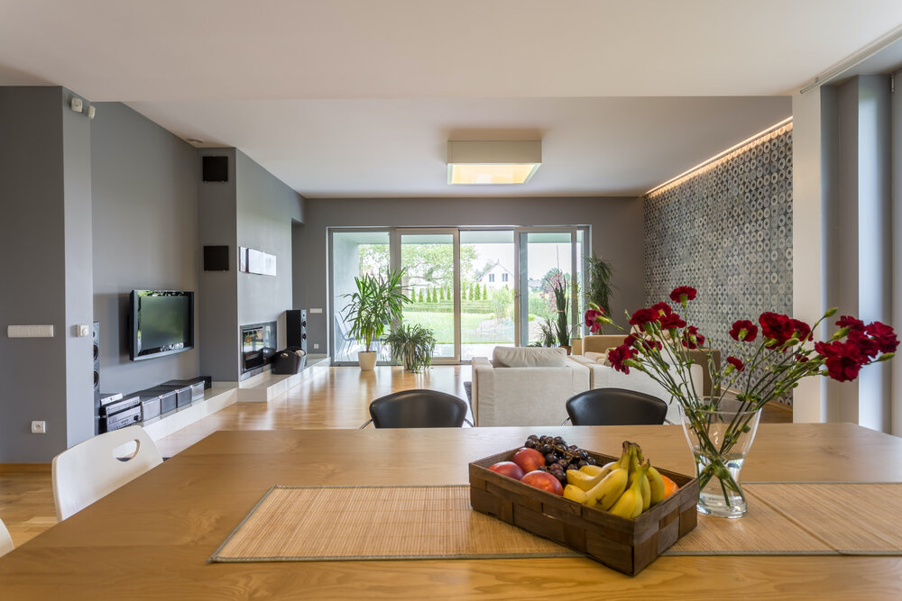 New style open floor plan apartment with dining set and tv living room